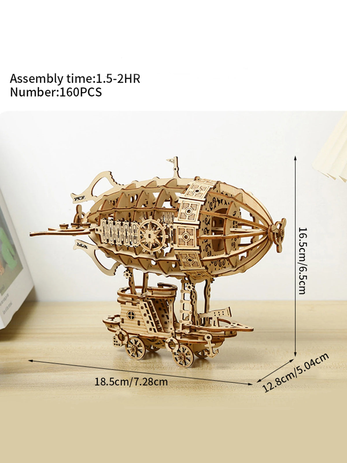 Wooden steampunk airship model kit showing dimensions, 160 pieces, and 1.5–2 hour assembly time