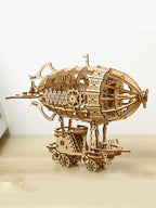Wooden steampunk airship 3D puzzle model kit displayed on a wooden surface