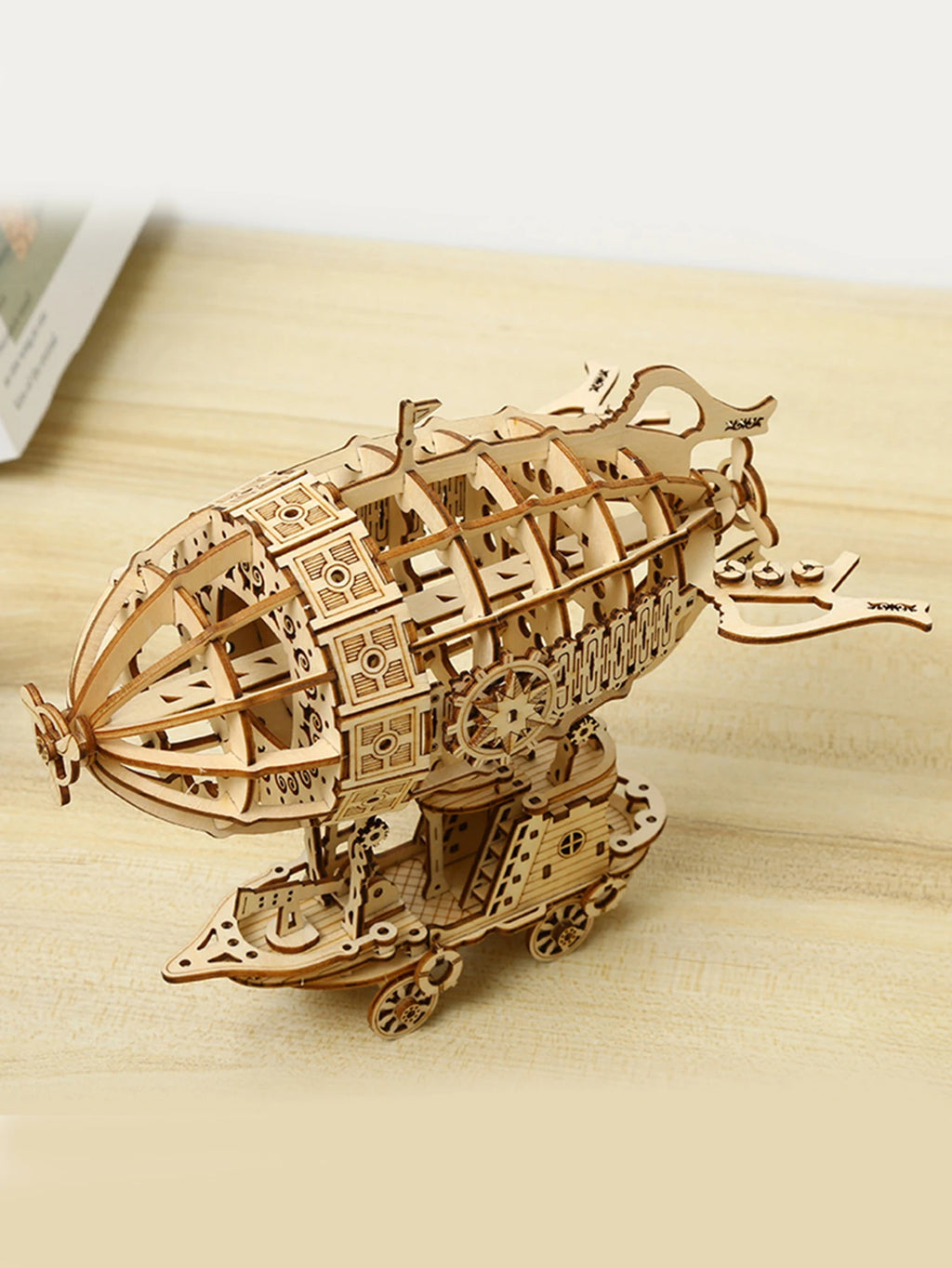 Side view of a wooden mechanical steampunk airship 3D puzzle model