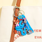 Zootopia 2 Gary blue snake keychain used as backpack charm on canvas bag