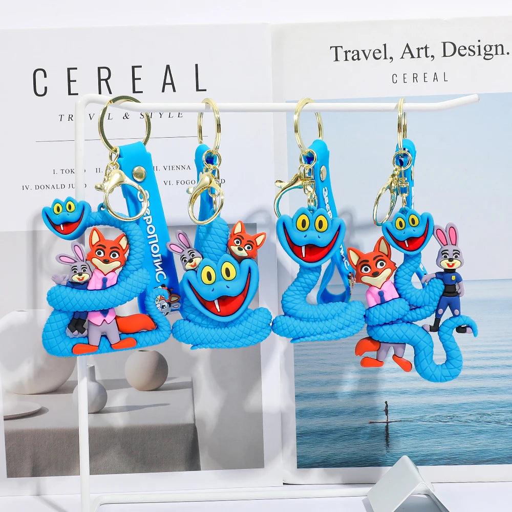 Zootopia 2 Gary blue snake PVC keychains hanging on display stand with magazine background